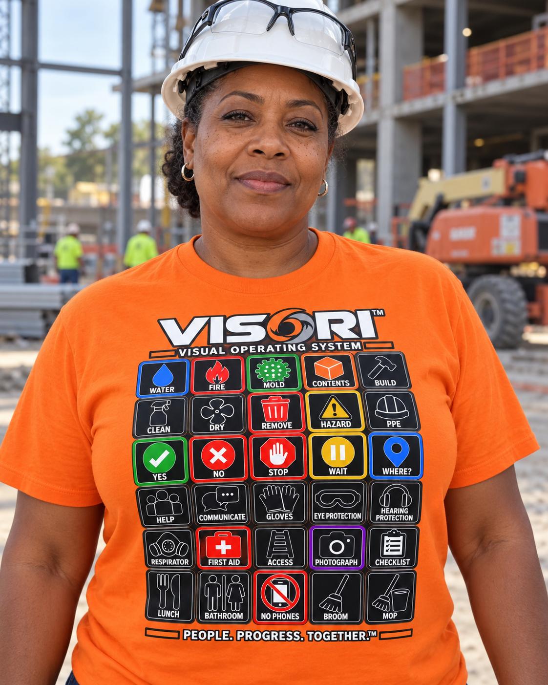 Worker wearing an orange VISORI communication shirt